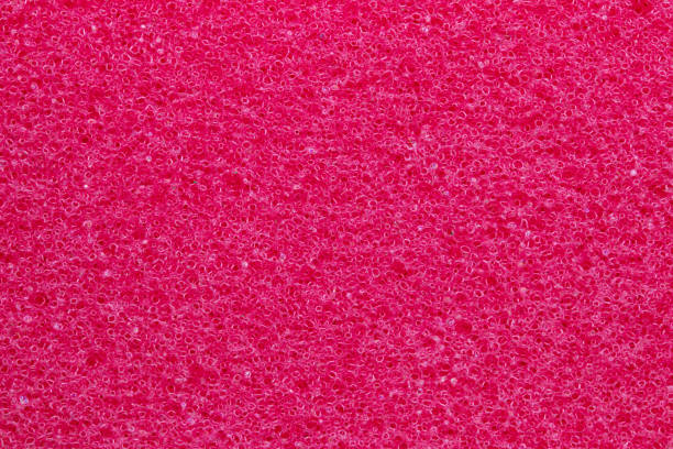 Sponge texture background. Close-up of red bath sponge texture with porous structure for background. Macro. Sponge texture background. Close-up of red bath sponge texture with porous structure for background. Macro. sponginess stock pictures, royalty-free photos & images