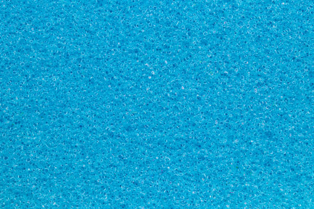 Sponge texture background. Close-up of blue bath sponge texture with porous structure for background. Macro. Sponge texture background. Close-up of blue bath sponge texture with porous structure for background. Macro. sponginess stock pictures, royalty-free photos & images