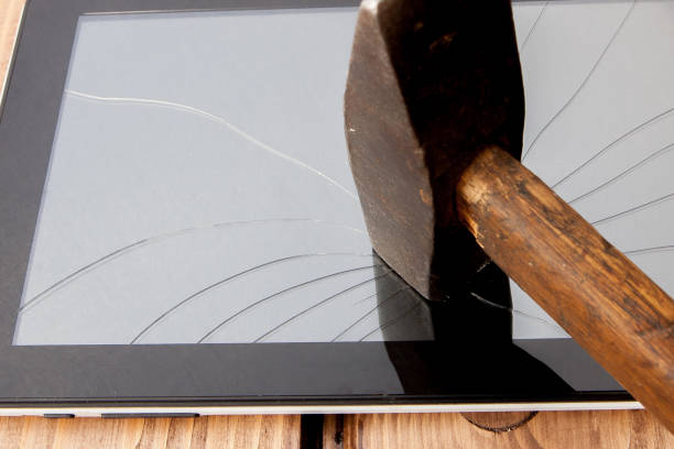 istock Smashed Screen Vandalised Broken Glass Close Up With Hammer 1134955101