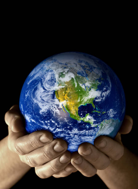 istock Hands holding the Earth with North America visible 1134956588