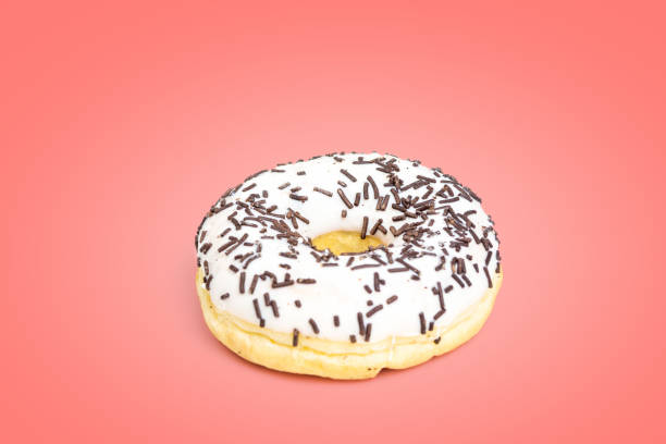 istock Sweet white donut isolated on pink background 1134956810