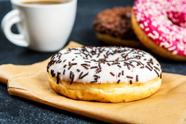 istock Sweet donuts on black stone table 1134957369