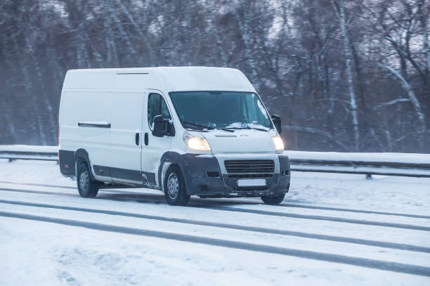 istock Minivan moves on winter road 1134958153