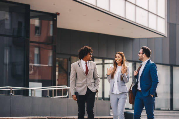 istock Three business people walking outdoors. 1134959930