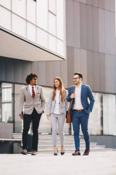 istock Three business people walking outdoors. 1134959933