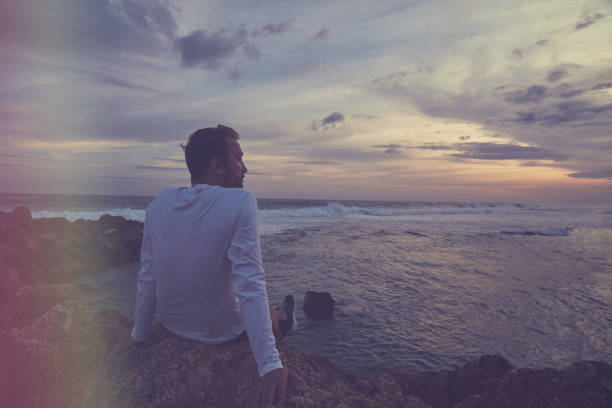 istock Man enjoying on the beach. 1134960871