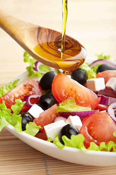 istock olive oil pouring over salad 113496089