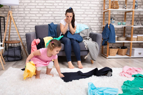 istock Shocked Mother Looking At Her Daughter Spreading Clothes 1134962178