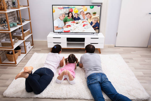 istock Family Watching Television At Home 1134962183