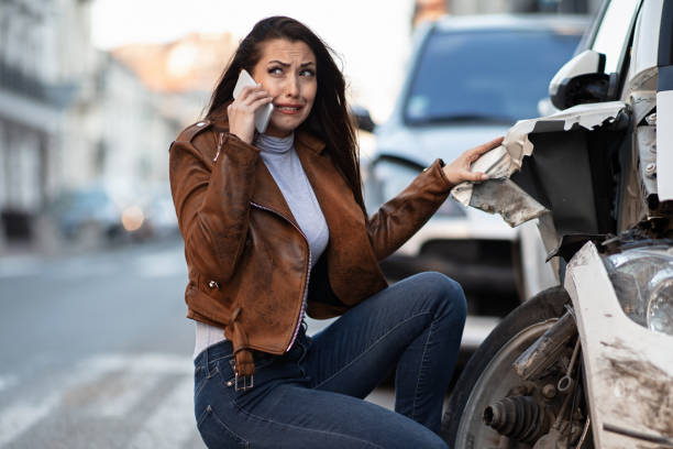 istock Frustrated woman calling for help after a car accident. 1134963377