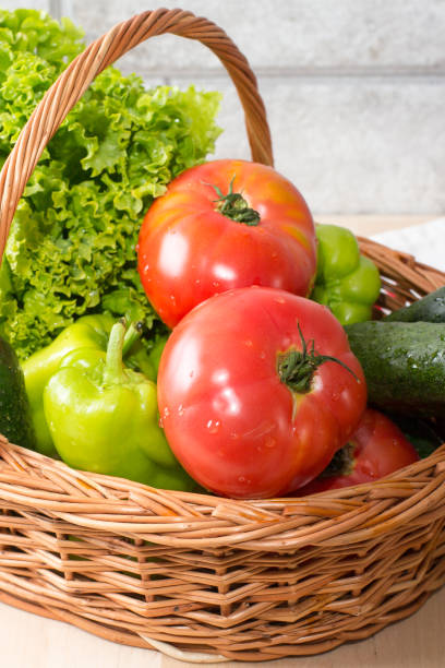 istock Fresh vegetables in basket. Tomato, cucumber, pepper and lettuce 1134963399