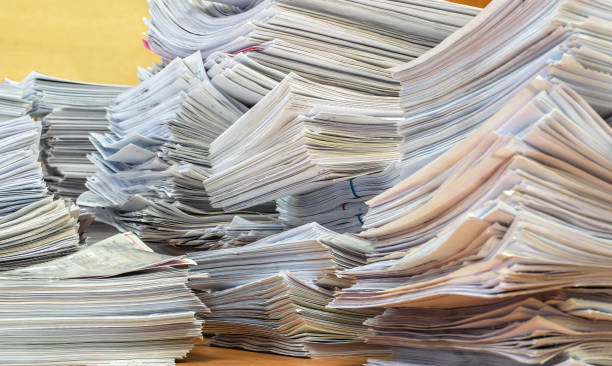 pile of paper documents in the office bundles bales of paper documents. stacks packs pile on the desk in the office bureaucracy stock pictures, royalty-free photos & images