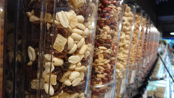 istock Different kinds of nuts are in transparent containers 1134964580