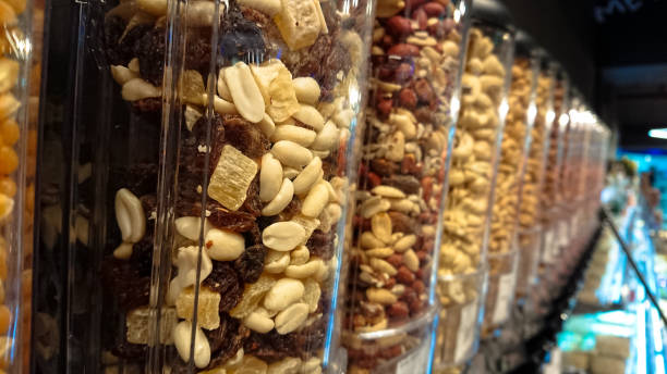 istock Different kinds of nuts are in transparent containers 1134964596