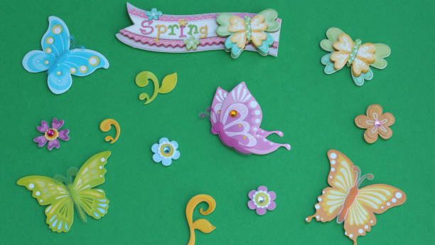 istock Butterflies with spring banner on green background 1134966391