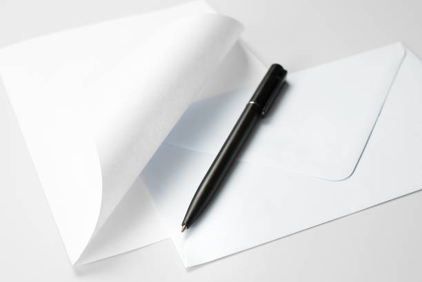 istock Correspondence Set: Blank Sheet of Paper with Curled Corner, Envelope and Black Pen 1134966598
