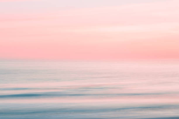 Abstract sunrise sky and  ocean nature background with blurred panning motion. stock photo