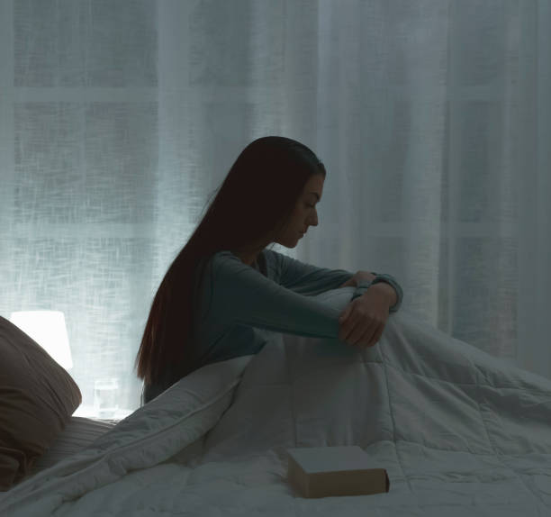 istock Sad woman suffering from insomnia in her bed 1134969436