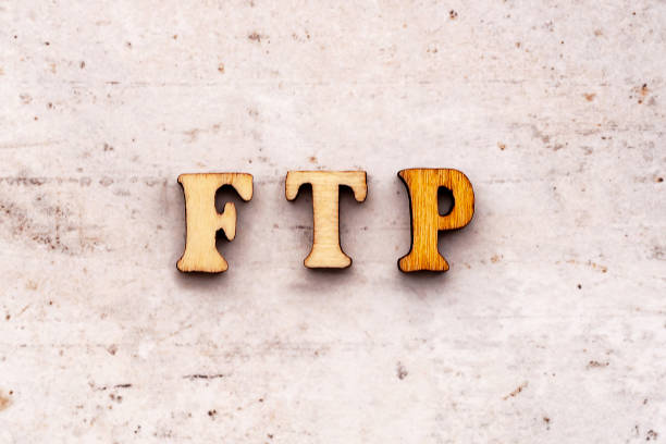 istock Inscription ftp File Transfer Protocol abbreviation in wooden letters on a light background 1134970806