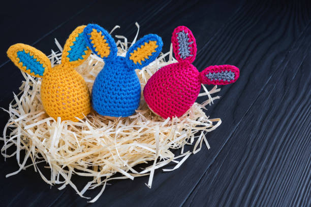 istock Cute creative photo with eggs as the Easter Bunny on a wooden background. 1134973968