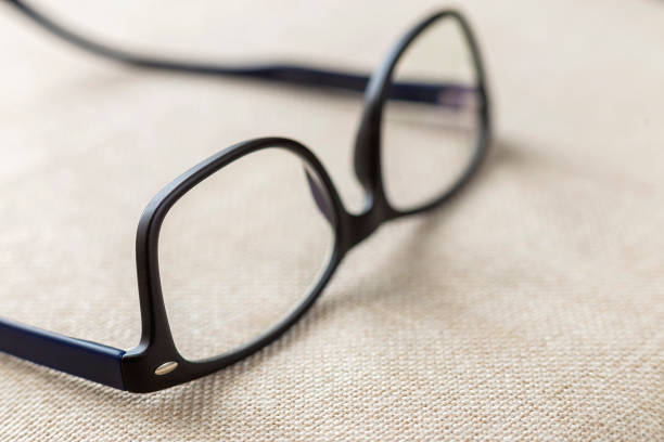 istock Reading spectacles, fashionable eyeglasses isolated on blurred white copy space background. 1134975179