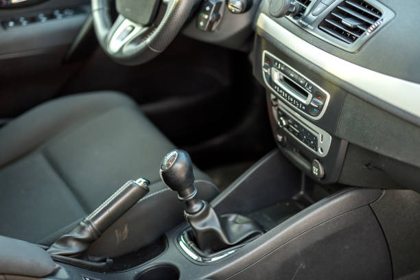 istock Luxurious car black leather interior. Handbrake manual brake and gearshift stick on blurred background. Transportation, design, modern technology concept. 1134975238