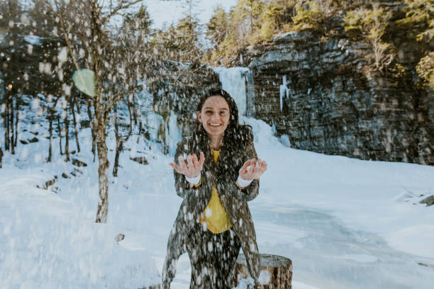 istock Woman throwing snow at him 1134981988