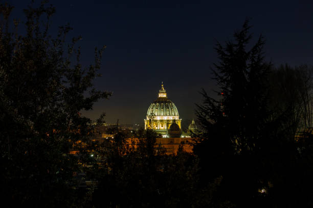 Ragusa Ibla, Sicily: The cupola of San Giorgio Cathedral, Illuminated at night under a full moon. Dating from the 1700s, the late baroque monument was designed by Rosario Gagliardi. Ragusa Ibla is a UNESCO World Heritage site. Copy space in the sky.