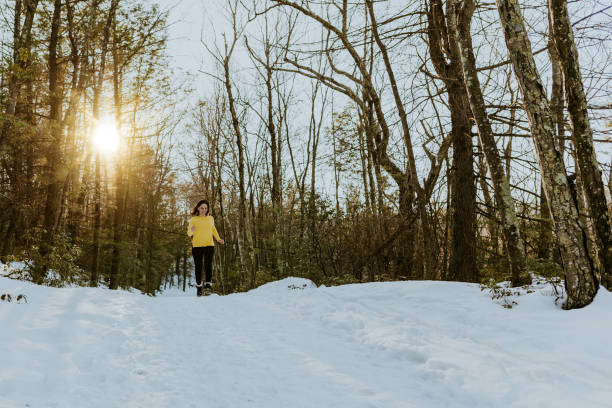 istock Woman jumping and walking on track with snow 1134982054