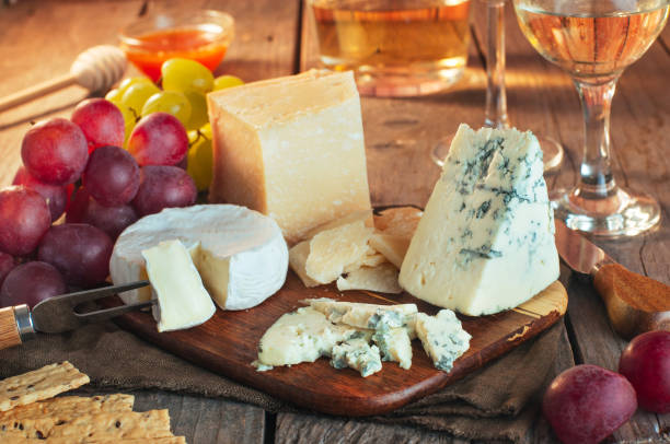 istock Various types of cheese on wooden cutting board 1134983191