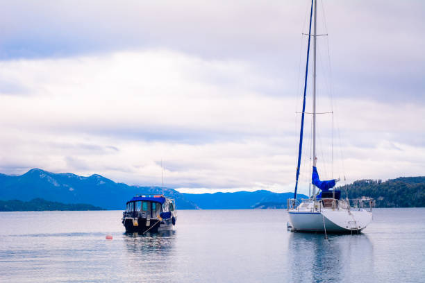 istock Boats sailing on calm lake water. 1134984397