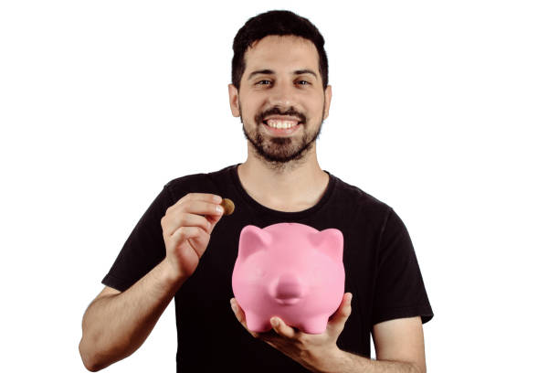 istock Young man with piggy bank 1134984438