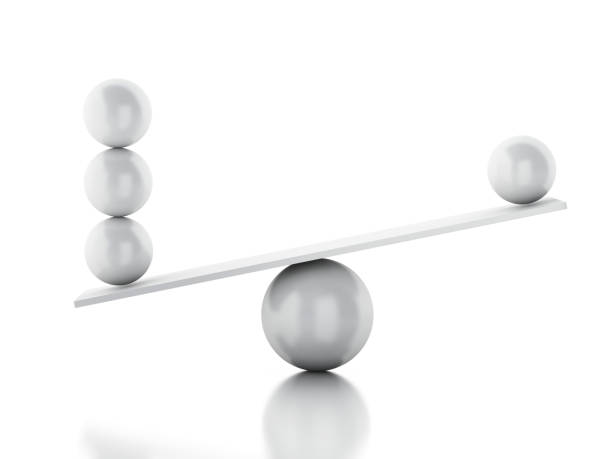 istock 3d Spheres balancing on a seesaw. 1134985118