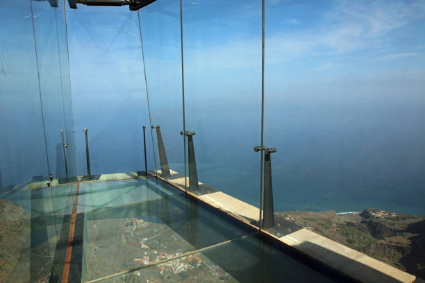 Mirador de Abrante Viewpoint with Glass Observation Balcony. Agulo. La Gomera. Spain Agulo, La Gomera, Spain – February 26, 2019 : Mirador de Abrante Viewpoint with Glass Observation Balcony. Its located  above Agulo Village on nothern part of La Gomera Island. Canary Islands. Spain agulo stock pictures, royalty-free photos & images