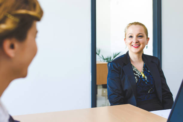 istock Businesswomen discussing with colleague 1134987572