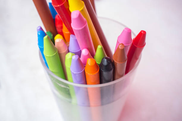 istock Plastic glass full of used wax crayons 1134994086