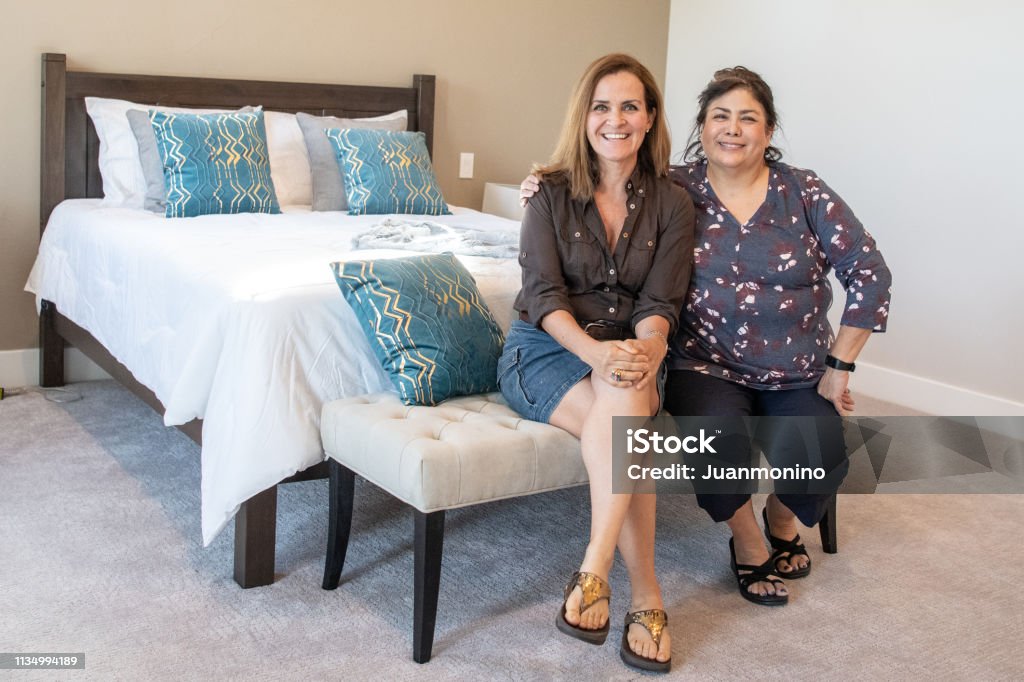 Mature Lesbian Multiethnic Couple Posing At Their Home Stock Photo -  Download Image Now - iStock