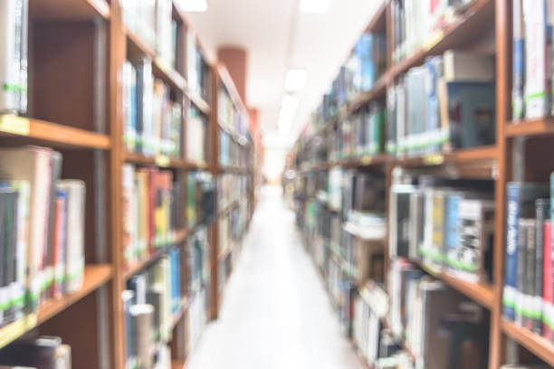 istock Blur school library or study room with book shelves for education background 1134996876