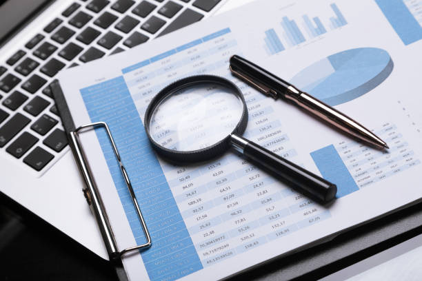 istock Office workplace with magnifier and stationery 1134997071