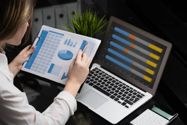 istock Businessman analyzing investment charts with laptop. Accounting 1134997099