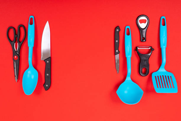 istock top view of stylish kitchen utensils isolated on red background 1134997547