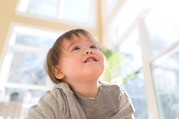 istock Happy toddler boy smiling in a big room 1134997661