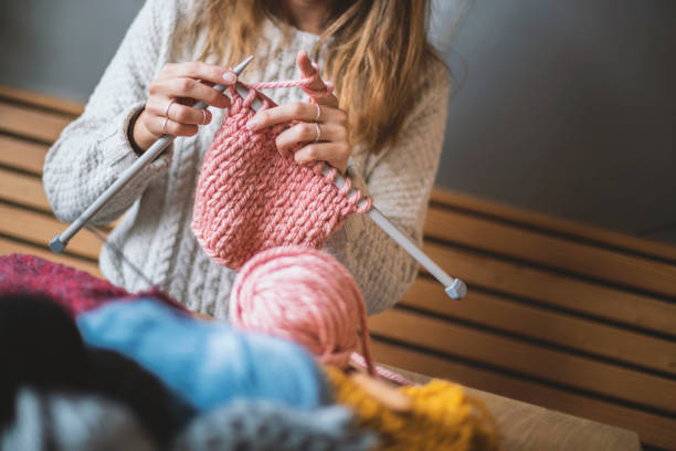 istock Close up on woman's hands knitting 1134998435