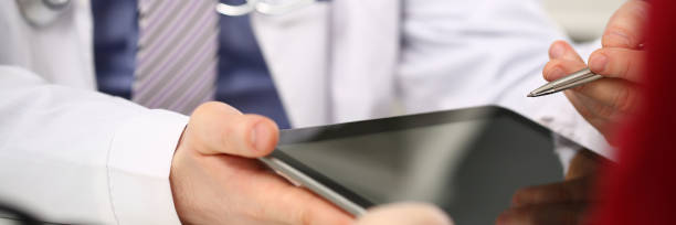 istock Female doctor hands hold and show digital 1134998674