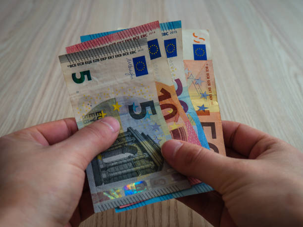 istock Hands holding euro banknotes 1134999682