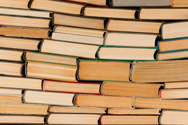 istock Stack of books background. many books piles 1135000996