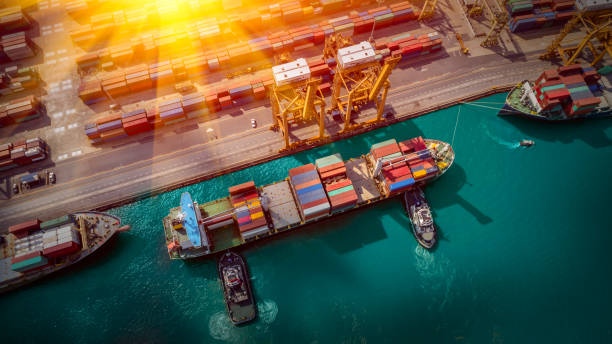 istock Logistics and transportation of Container Cargo ship and Cargo plane with working crane bridge in shipyard, logistic import export and transport industry background 1135002794