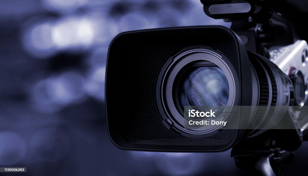 Camera lens with lense reflections. Home Video Camera Stock Photo