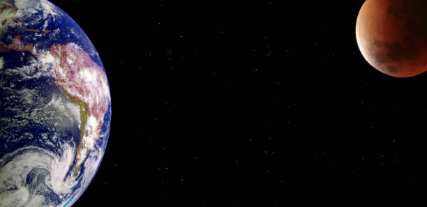istock Planet earth and eclipsed blood supermoon from the space at night 1135006443