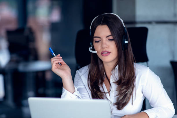 istock Portrait of happy smiling female customer support phone operator at workplace. 1135007097